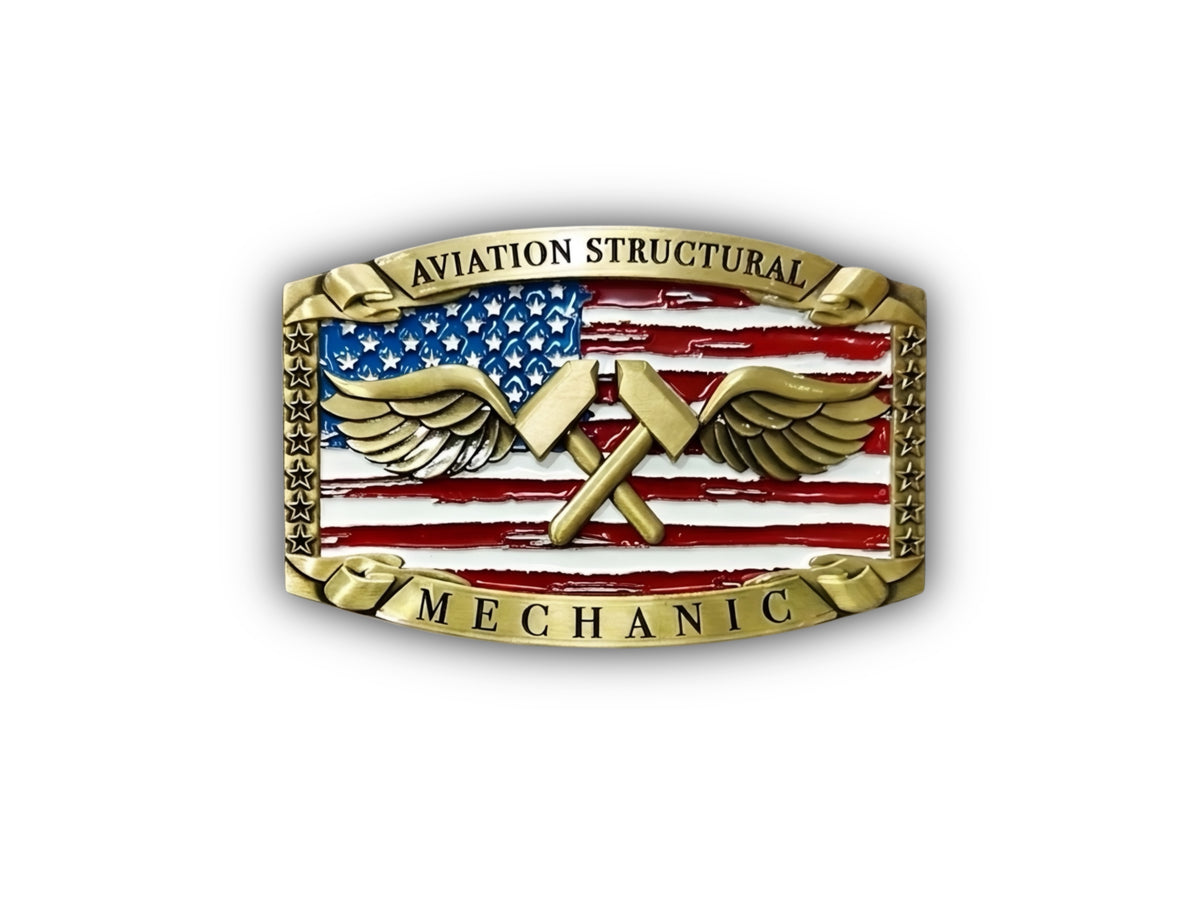 An Aviation Structural Mechanic belt buckle featuring a gold-tone metal border, wings, crossed tools, and an American flag design with red, white, and blue enamel.