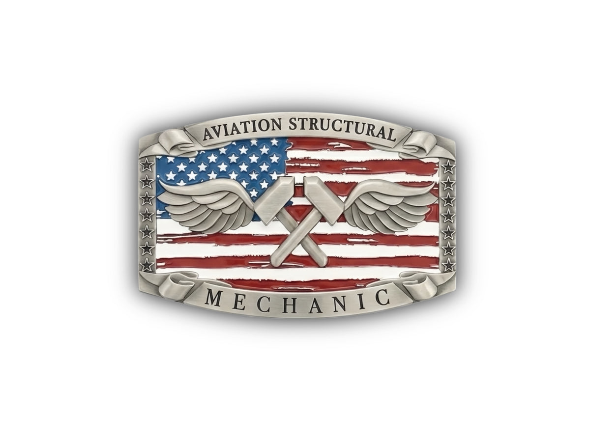 An Aviation Structural Mechanic belt buckle featuring a distressed American flag design with silver wings and crossed tools, set against a plain white background.